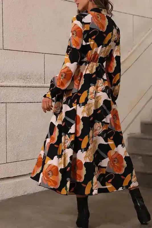 Back view of elegant orange floral long sleeve dress with high waist and A-line silhouette, perfect for Southern Belle style.