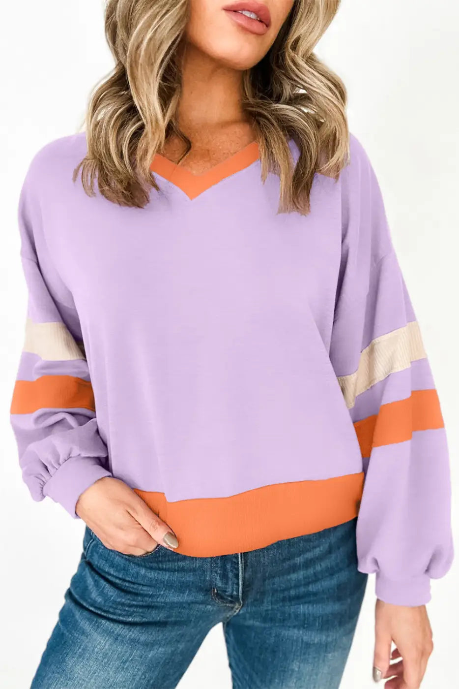 Orchid rib knit sweatshirt: lavender-orange color-block, striped sleeves, v-neckline. Relax