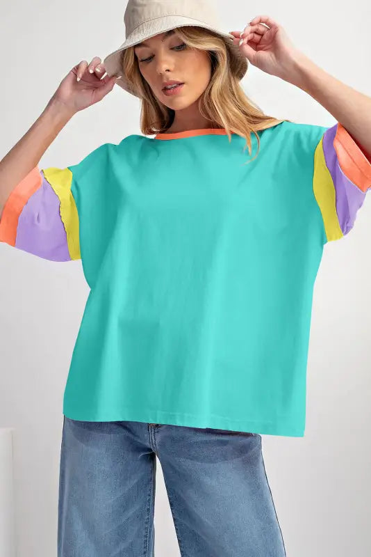 Oversized stitched top: colorful teal body and multicolored sleeves for a relax relax style