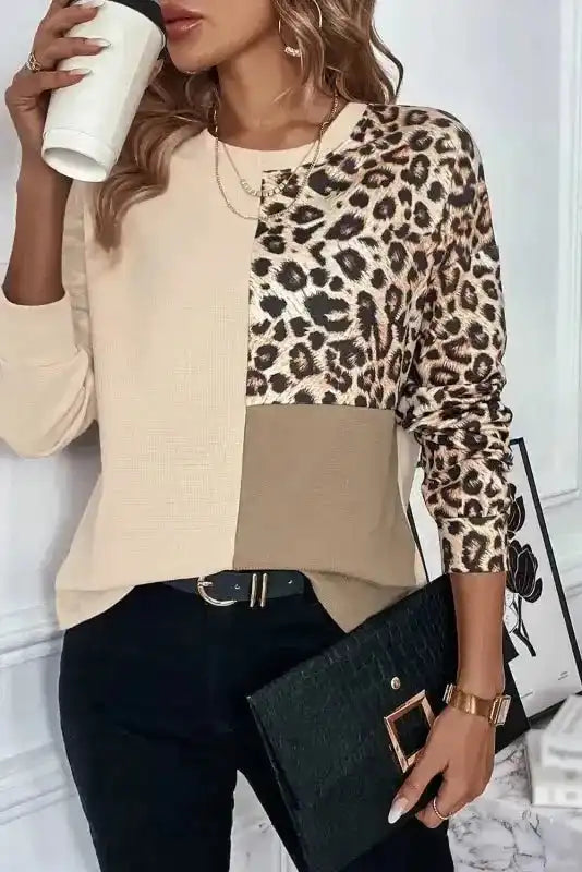 Close-up of FashionFitz Khaki Leopard Colour‑block Waffle Knit Top styled with black pants and accessories for a chic fall outfit.