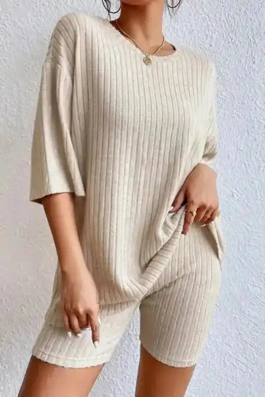 Front view of beige ribbed knit plus size lounge set with short sleeves and high-stretch shorts for relaxed style.