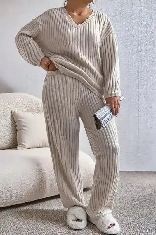 Plus size ribbed V-neck pullover pants set in beige with wide-leg silhouette and high stretch fabric for casual home wear.