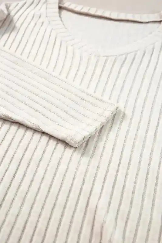 Detailed view of sleeve and neckline on Ribbed V-Neck Set - Plus Size Pullover Pants highlighting ribbed texture and stitching.