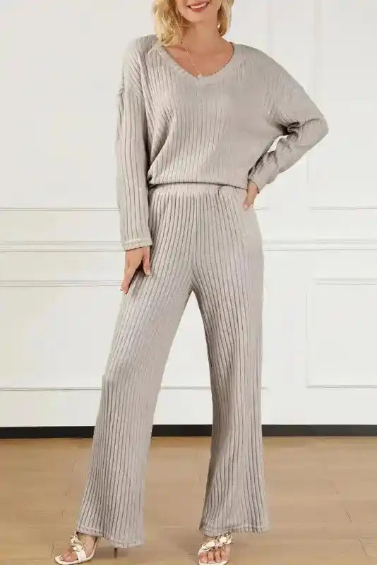 Light gray ribbed V-neck pullover and wide-leg pants set in plus size, featuring high-stretch fabric for stylish comfort.