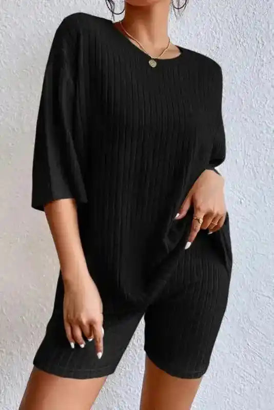 Front view of black ribbed plus size pullover and shorts set with high stretch fabric for casual wear.