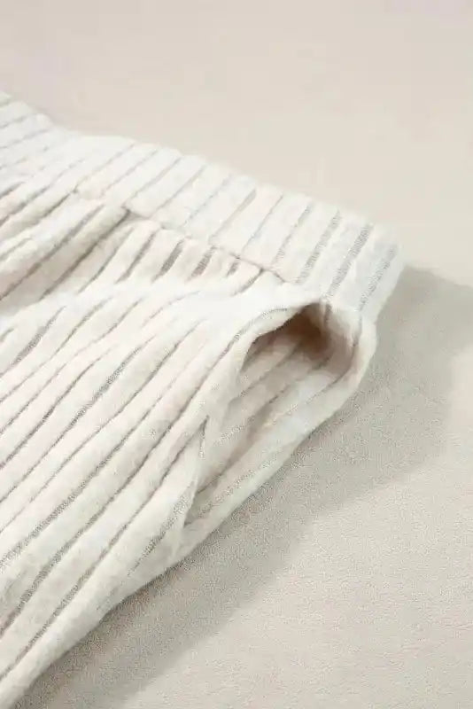 Side pocket detail of Plus Size Ribbed Pullover Pants Set highlighting functionality and soft ribbed fabric.