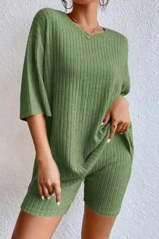 Green ribbed plus size lounge set with short sleeves and shorts, offering a casual fit and soft ribbed texture.