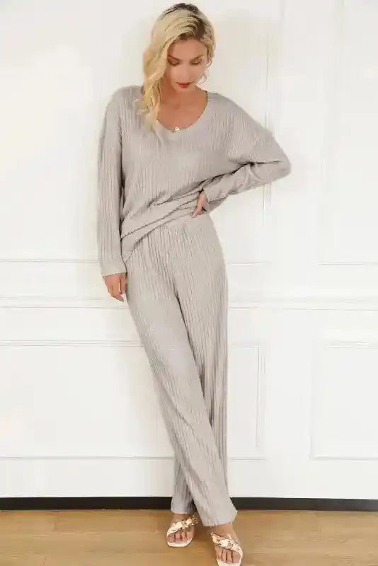 Plus size light gray ribbed V-neck pullover and pants set with relaxed fit and high-stretch fabric for casual elegance.