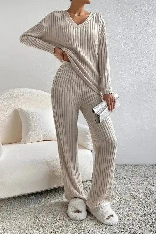 Beige ribbed V-neck pullover and wide-leg pants set in plus size, featuring high stretch fabric for cozy loungewear or casual outings.