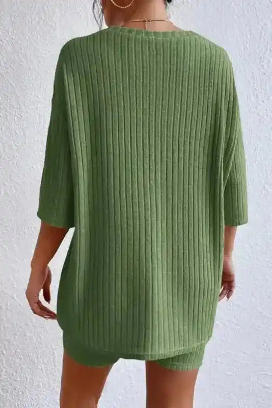 Green plus size ribbed pullover with half sleeves and relaxed fit, part of a high-stretch V-neck pants set for casual home wear.