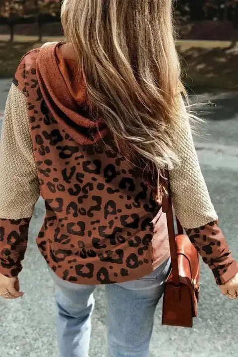 Back view of Patchwork Leopard Hoodie Oversized Textured Knit in brown with bold animal print and waffle-knit sleeves, styled for casual wear.