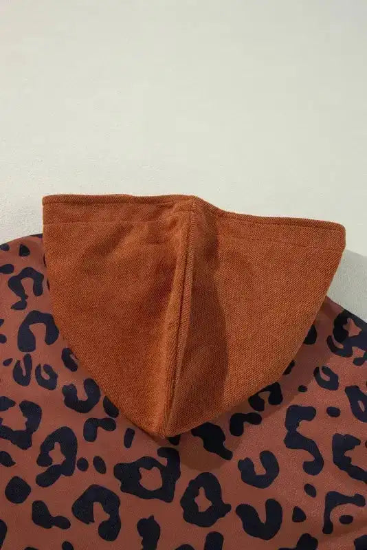 Close-up of the hood on the Patchwork Leopard Hoodie Oversized Textured Knit, highlighting the textured knit fabric and stitching.