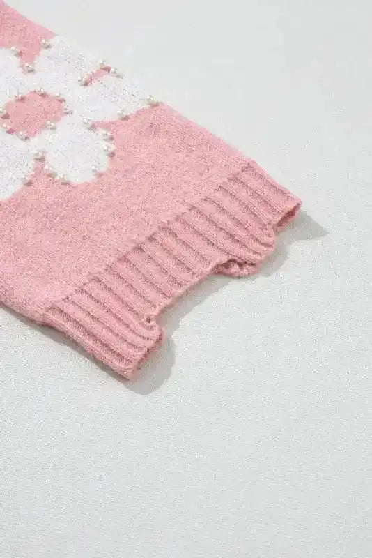 Close-up of sleeve on Ladies Pink Pearl Beaded Floral Sweater by FashionFitz, featuring ribbed cuff and pearl detailing.