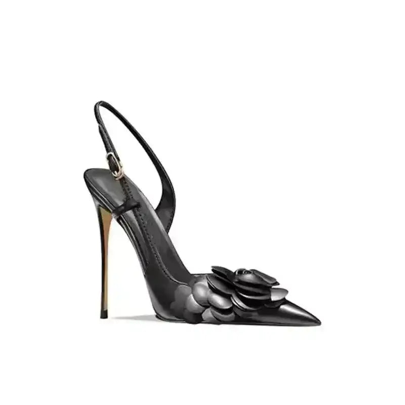 Side profile of black Petal Pirouette Slingback Heels with floral toe design and high stiletto heel, exclusive at FashionFitz.
