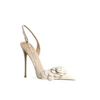 Elegant Petal Pirouette Slingback Heels in ivory with floral appliqué and stiletto heel, perfect for formal wear at FashionFitz.