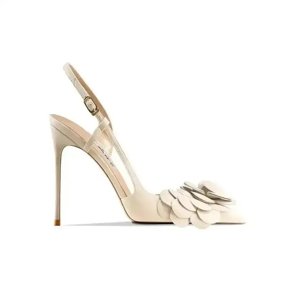 Side view of ivory Petal Pirouette Slingback Heels with sculpted petals and pointed toe, ideal for weddings or formal occasions.
