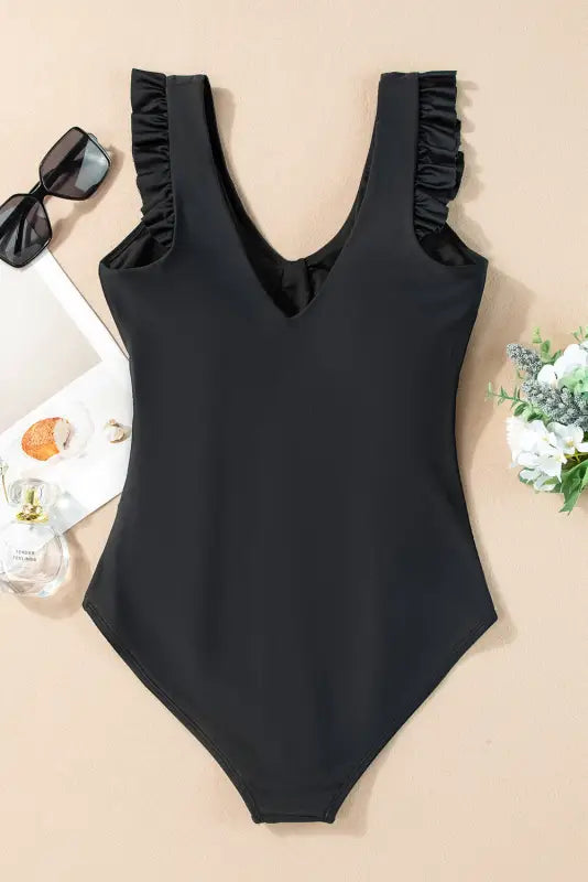 One-piece bathing suit with ruffled shoulder straps and v-neckline in black