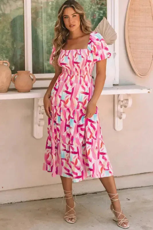 Close-up of brush stroke abstract print and ruffle tier detail on smocked midi dress Fashionfitz UK