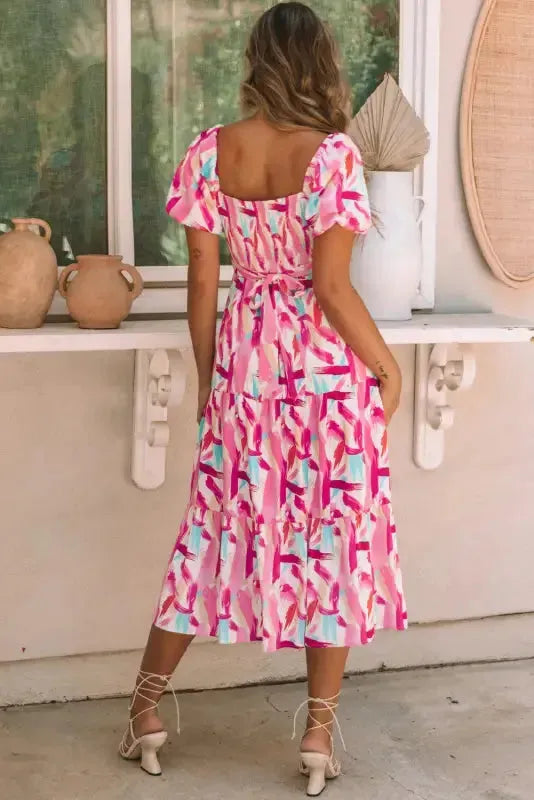Side view of brush stroke print smocked midi dress showing A-line tiered skirt Fashionfitz UK