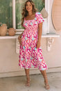 Woman wearing pink smocked ruffle tiered midi dress front view Fashionfitz UK