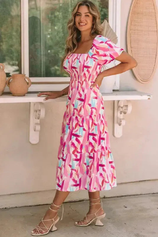 Back view of pink ruffle tiered midi dress with smocked bodice Fashionfitz UK