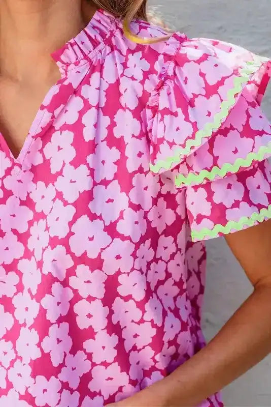 Side view of Pink Floral Ruffle Sleeve Blouse showing tiered ruffle sleeve movement and relaxed cotton silhouette — Fashionfitz