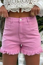 Ladies pink mid rise denim shorts with frayed hem and stretch cotton, styled with a white lace crop top for summer wear.