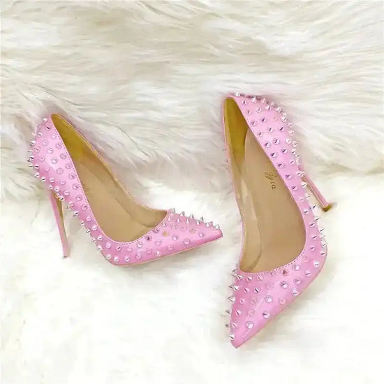 Pair of FashionFitz Pink Studded Court Heels on faux fur background, designed for weddings, events, and fashionable nights out.