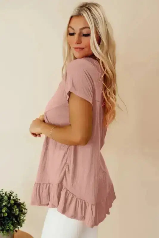 Side view of Pink Short Sleeve Ruffle Hem Blouse showing relaxed silhouette and flirty ruffle hem detail — Fashionfitz
