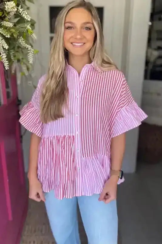 Model wearing Chic Pink Stripe Ruffled Shirt featuring short ruffled sleeves and a relaxed fit, perfect for daily summer wear.