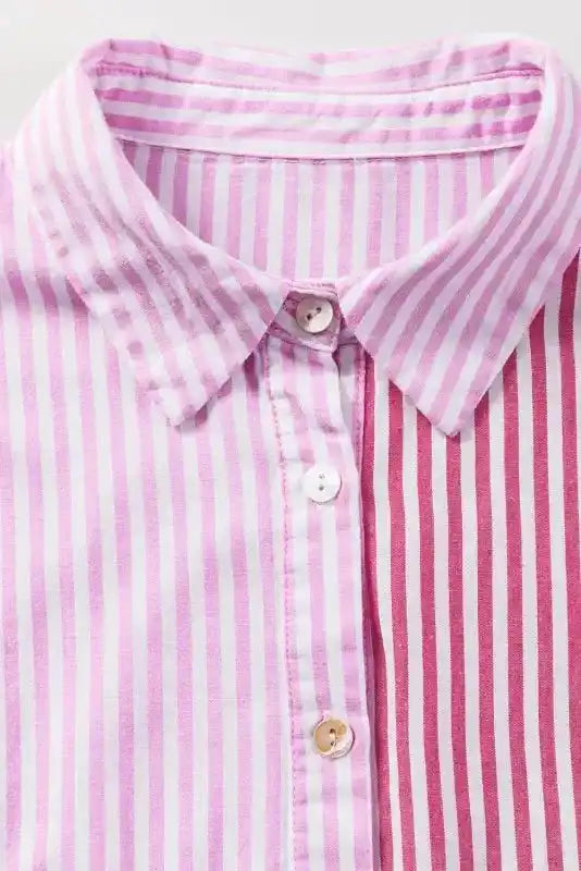 Front collar and button detail of Chic Pink Stripe Ruffled Shirt featuring mixed stripe panels and classic shirt collar.