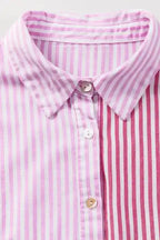 Front collar and button detail of Chic Pink Stripe Ruffled Shirt featuring mixed stripe panels and classic shirt collar.