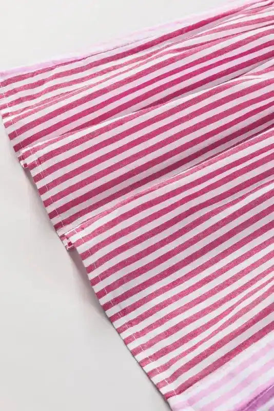 Sleeve detail of Pink Stripe Ruffled Shirt showing layered ruffle trim and alternating stripe directions for added texture.