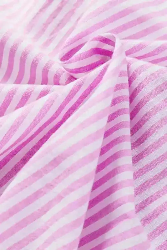 Fabric close-up of Chic Pink Stripe Ruffled Shirt, emphasizing lightweight, breathable cotton with pink and white stripes.