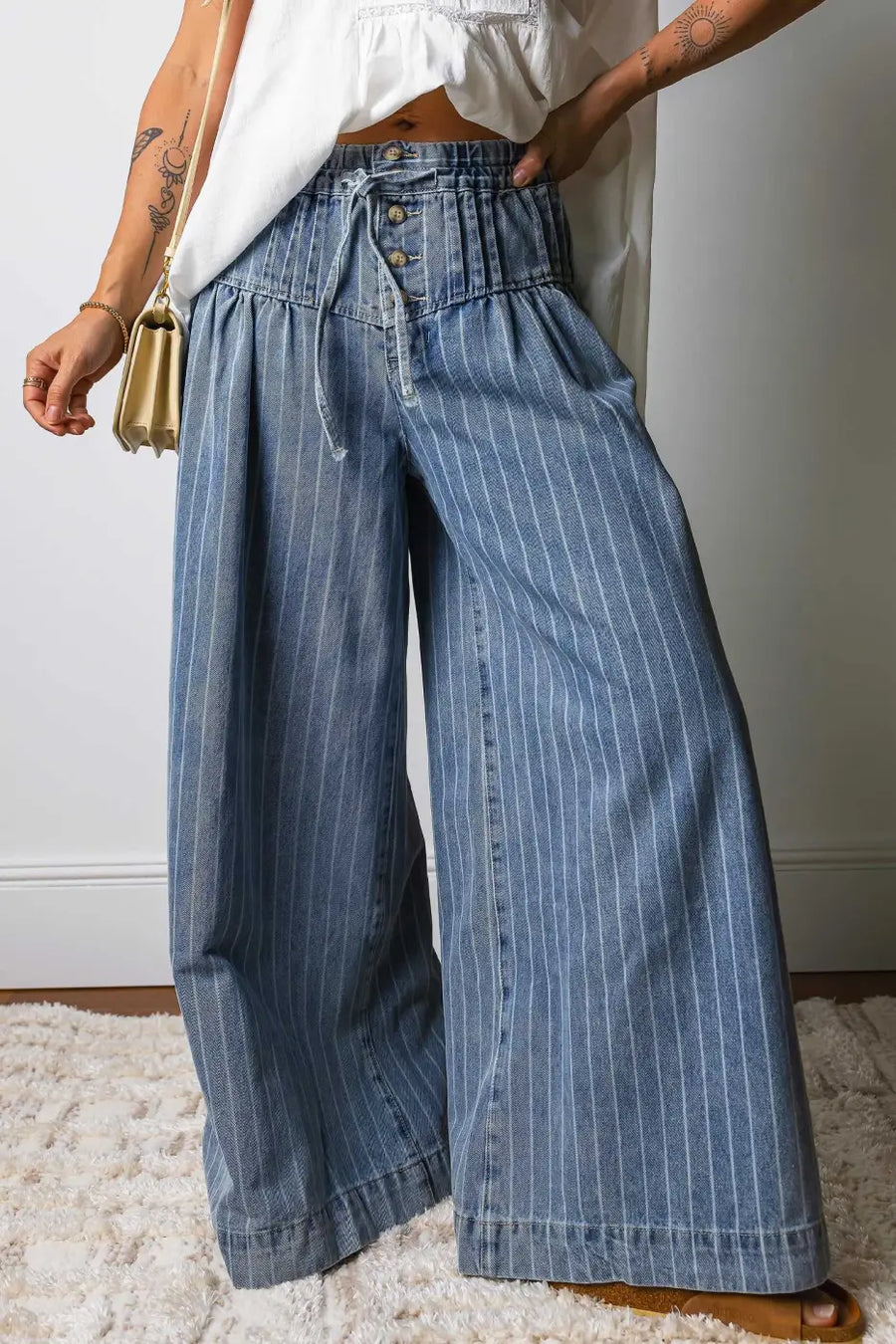 Women's pinstripe drawstring wide leg jeans in soft blue cotton denim with high waist and relaxed fit, ideal for casual streetwear looks.