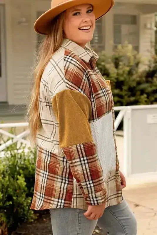 Side angle of the plus-size plaid patchwork shacket featuring mixed fabrics and a cozy, relaxed silhouette.