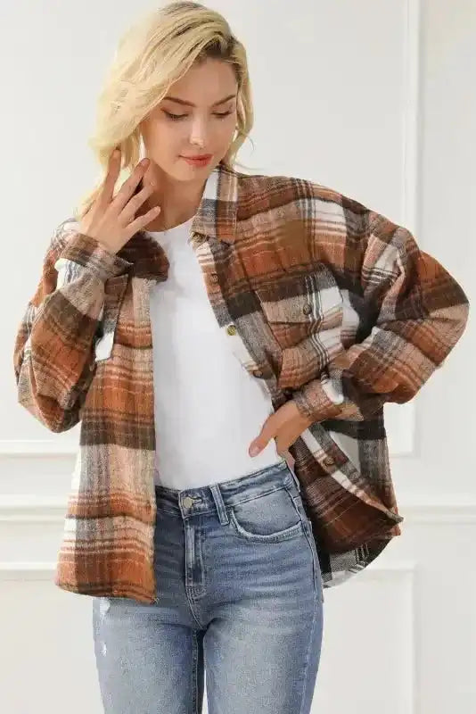 Relaxed fit plaid shacket with flap pockets styled casually, great for daily fall outerwear.