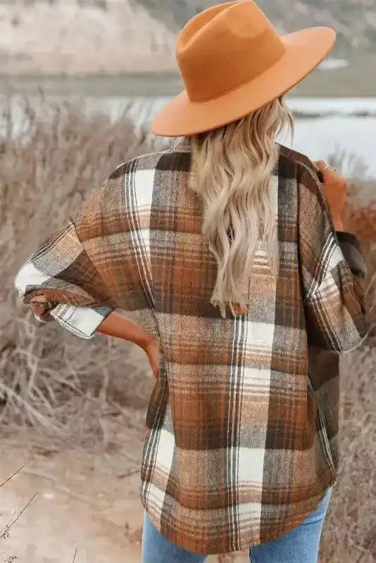Back view of plaid shacket flap pockets in warm autumn tones, ideal for casual fall outerwear looks.