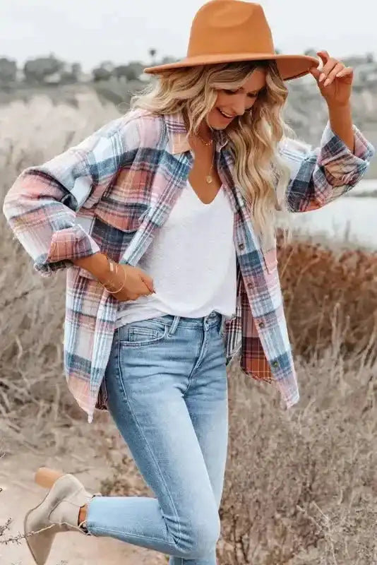 Smiling woman in pastel plaid Stylish Plaid Shacket with Flap Pockets, styled with light denim and neutral boots.