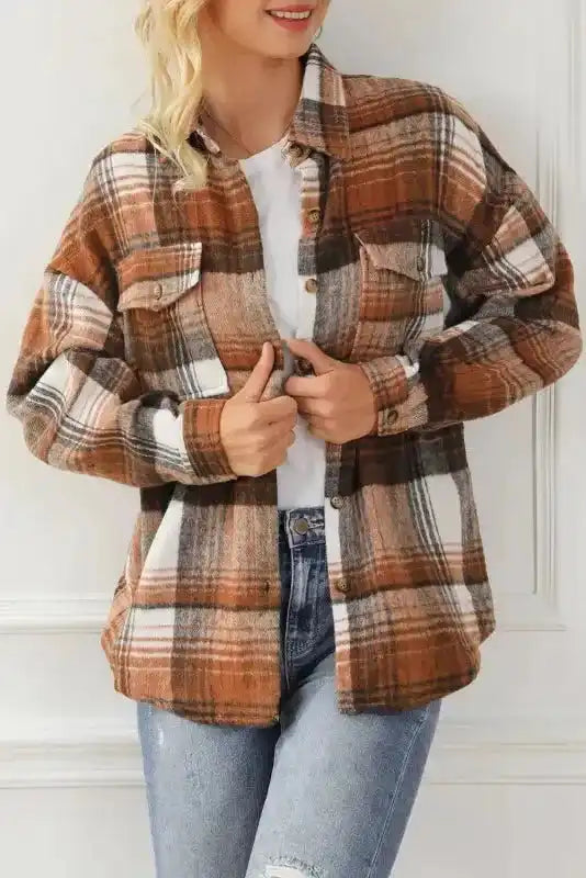 Front view of plaid shacket with flap pockets styled over a white tee, great for casual fall outfits.