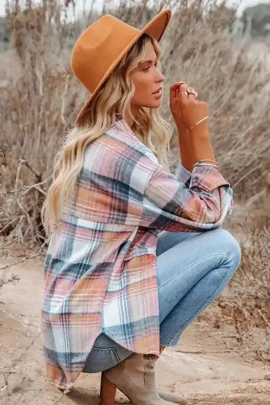 Side view of woman squatting in pastel plaid Stylish Plaid Shacket with Flap Pockets, styled for a cozy fall look.