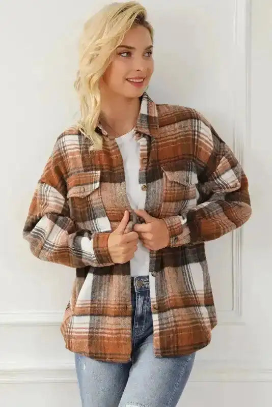Chic plaid shacket flap pockets styled with rolled sleeves, perfect for autumn layering.