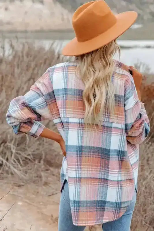 Back view of Stylish Plaid Shacket with Flap Pockets in pastel tones, styled with a tan hat for a fall outdoor outfit.