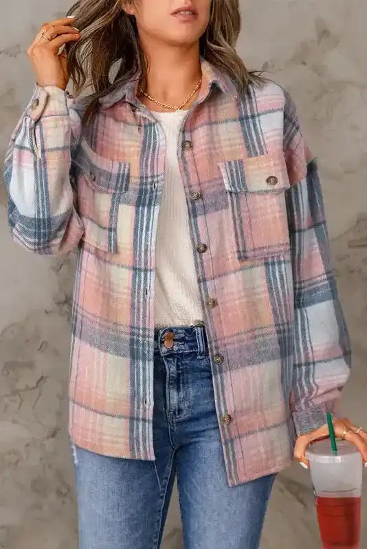 Woman wearing pastel plaid Stylish Plaid Shacket with Flap Pockets, styled with jeans and a white top for a casual fall look.