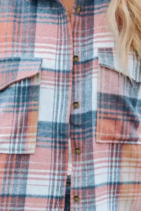 Close-up of flap pockets and buttons on pastel plaid Stylish Plaid Shacket, highlighting texture and detailing.