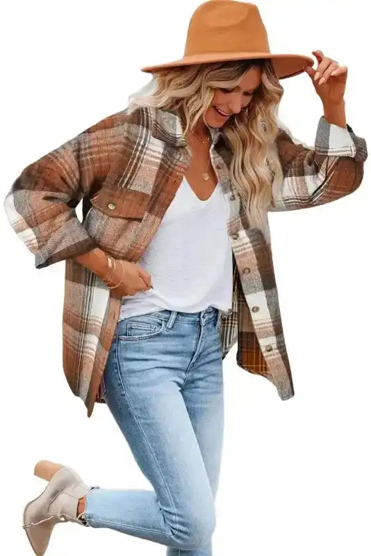 Model wearing stylish plaid shacket flap pockets with jeans and boots, highlighting fall outerwear trends.