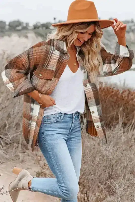 Plaid shacket flap pockets paired with light denim and a hat, showcasing cozy fall fashion style.