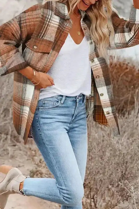 Stylish plaid shacket with flap pockets styled with jeans and a white tee, perfect for fall fashion layering outdoors.