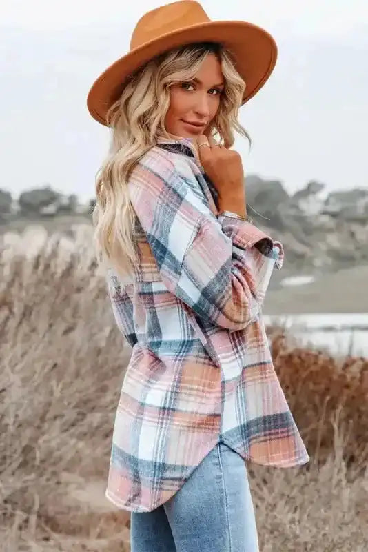 Side-back view of Stylish Plaid Shacket with Flap Pockets in pastel tones, styled with a tan hat and light jeans.