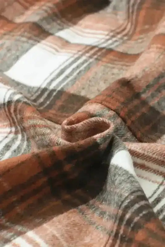 Close-up of soft plaid fabric in brown, white, and gray tones from the Stylish Plaid Shacket with Flap Pockets for Fall Fashion.